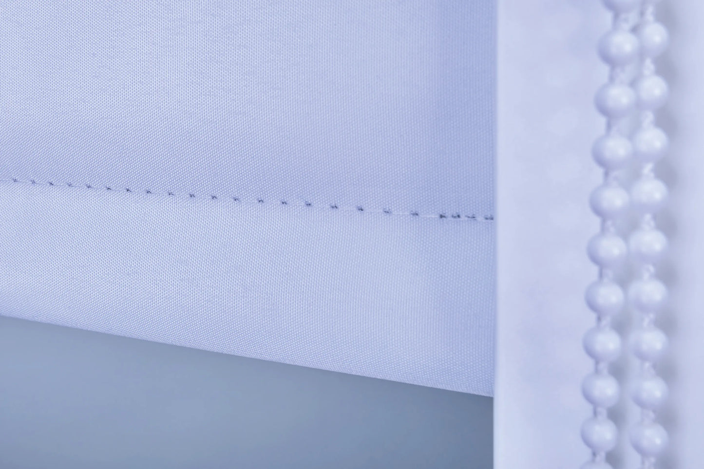 Rolgordijn detailbeeld doek en ketting